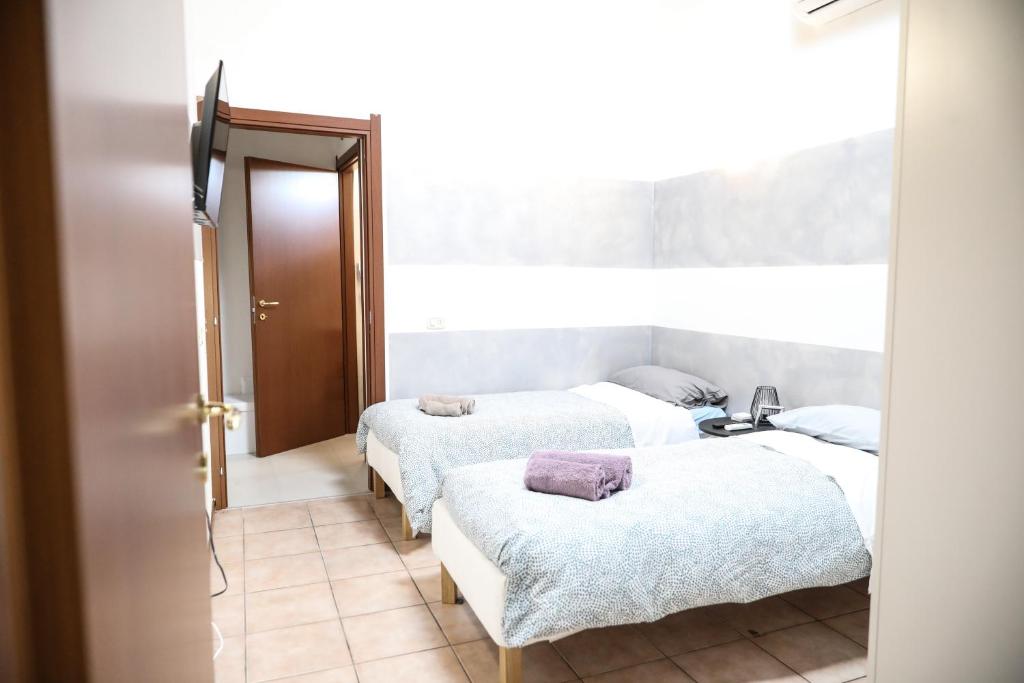 Postel nebo postele na pokoji v ubytování Piccinardi house - appartamento 4 posti letto