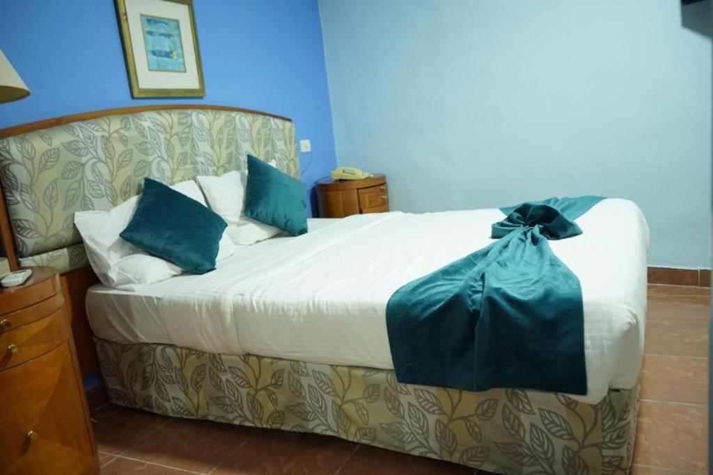 Postel nebo postele na pokoji v ubytování Conord Hotel