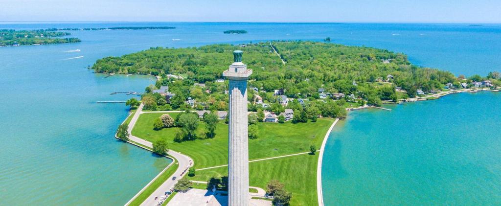 an aerial view of a monument on a island in the water at Bayshore Resort at Put-in-Bay in Put-in-Bay