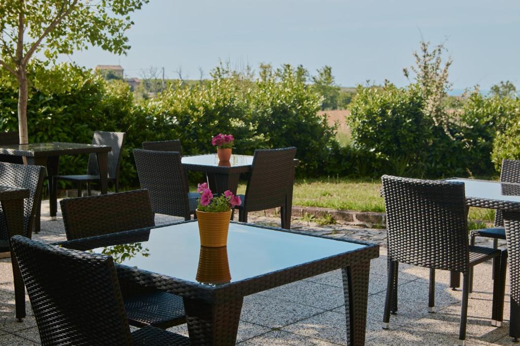 a group of tables and chairs on a patio at Villa Marianna in Vasto
