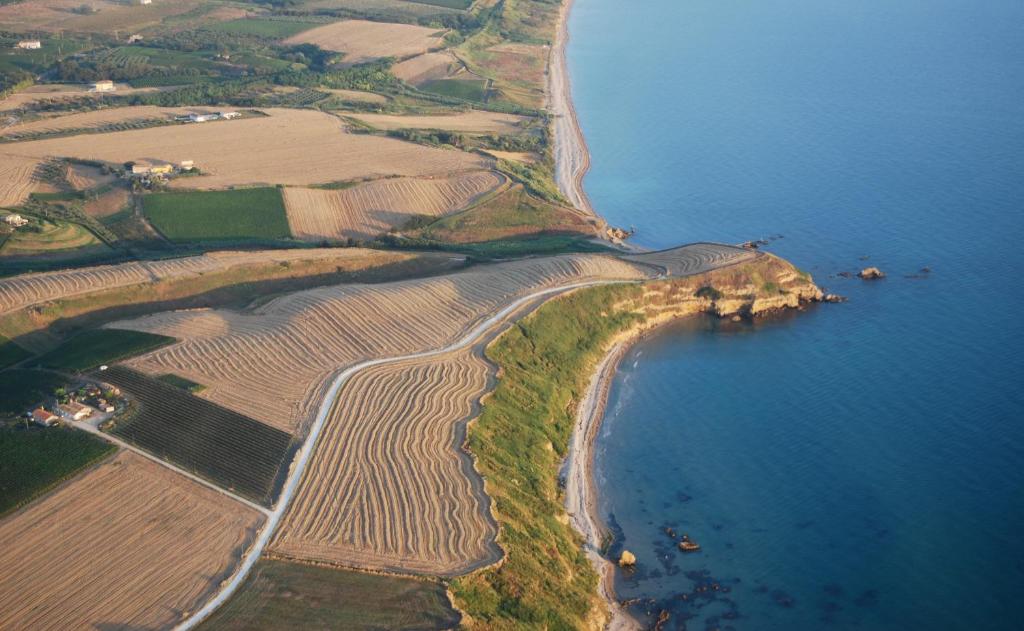 an aerial view of a farm field and the ocean at Villa Marianna in Vasto