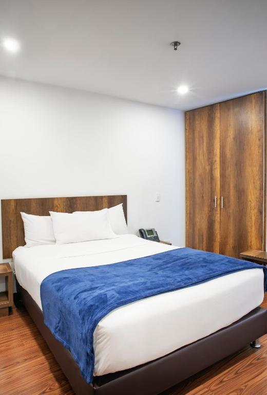 Postel nebo postele na pokoji v ubytování Hotel Black Usaquen