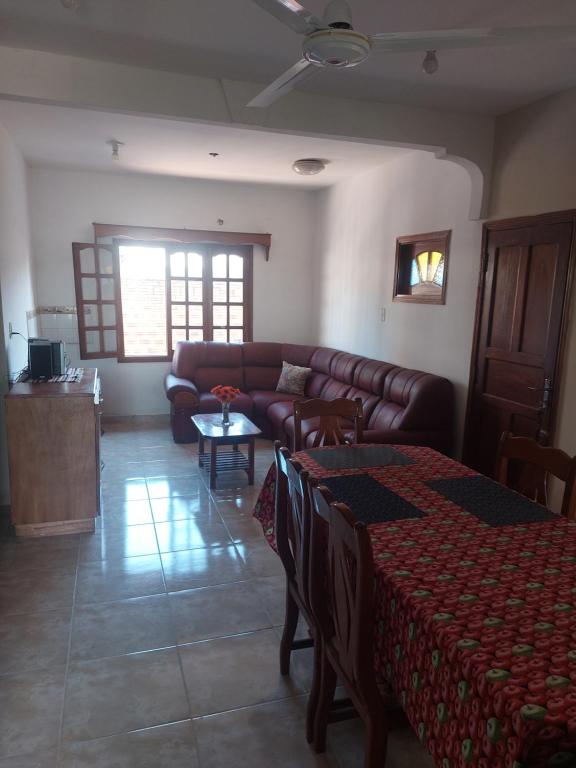 a living room with a couch and a table at Hostal Pablito in Encarnación