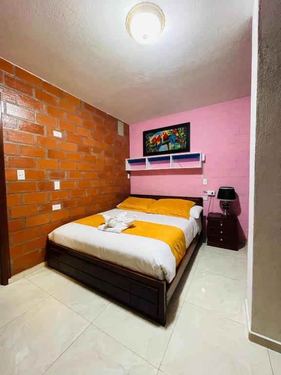 Postel nebo postele na pokoji v ubytování Hostal Balcon del Cielo