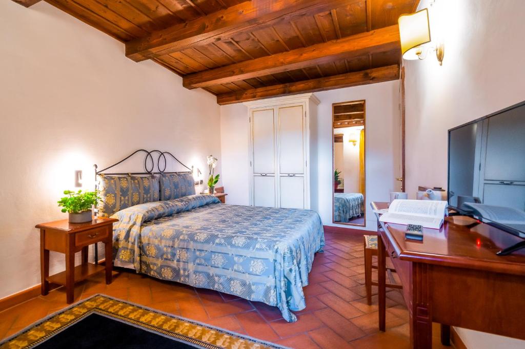 Postel nebo postele na pokoji v ubytování Albergo Falterona