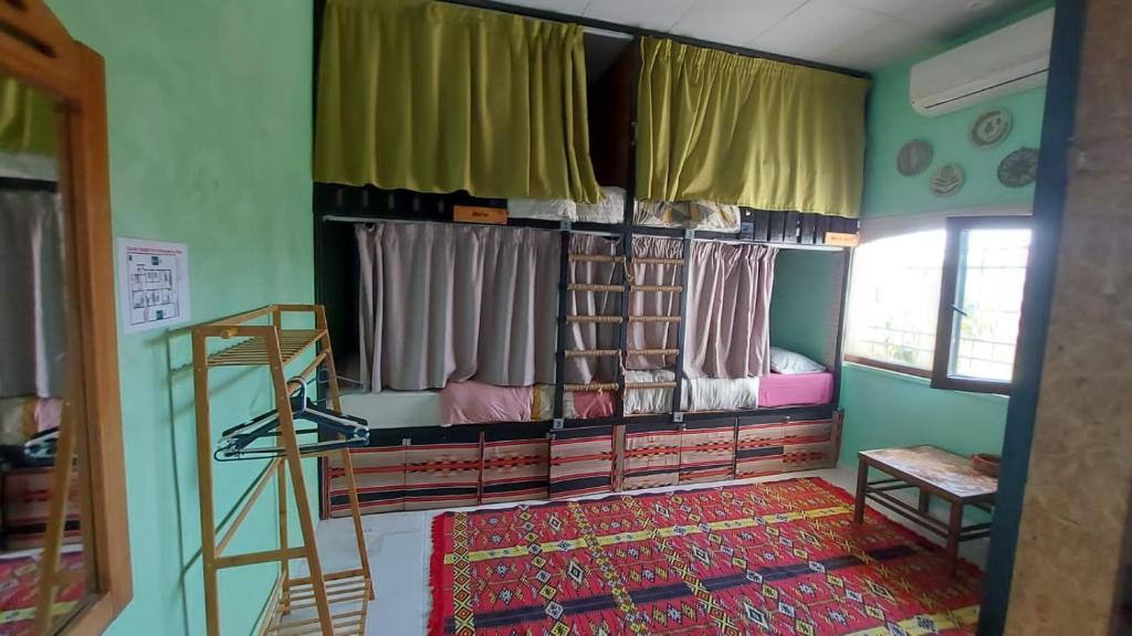 Postel nebo postele na pokoji v ubytování Carob Hostel