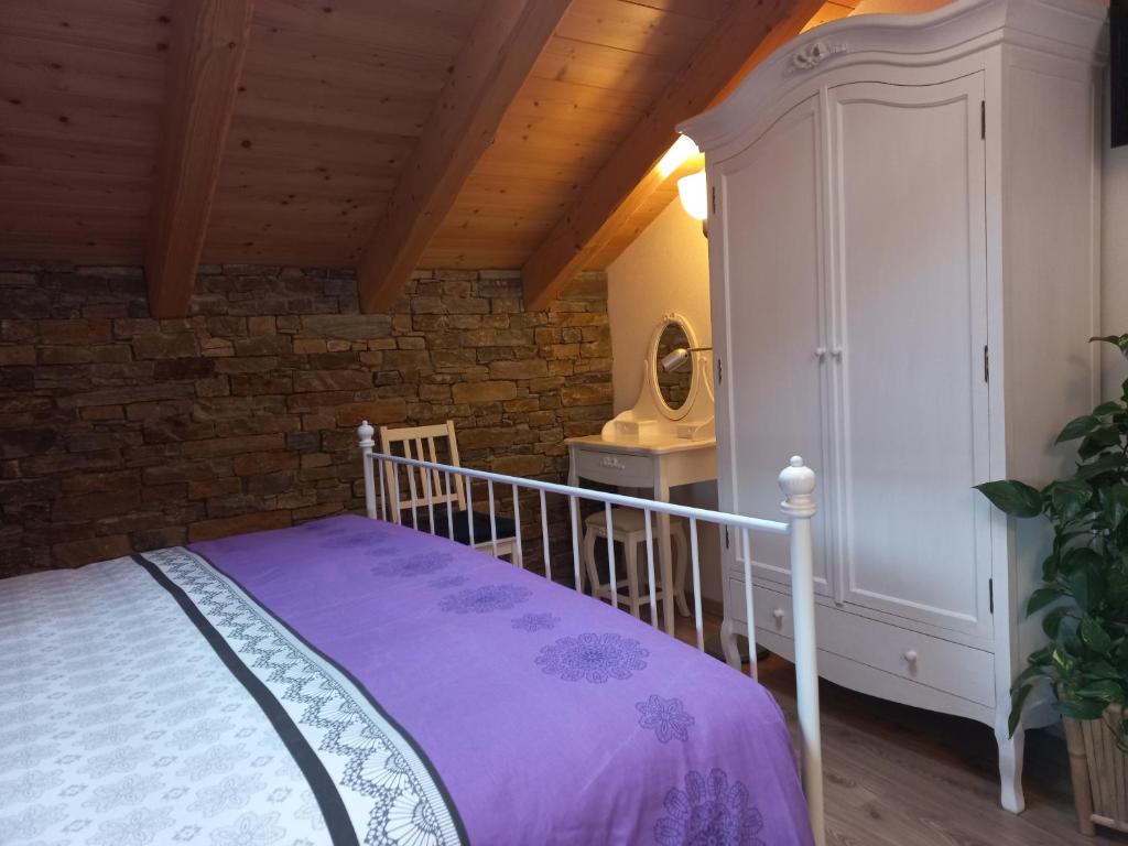 Postel nebo postele na pokoji v ubytování B&B Ai Marchetini