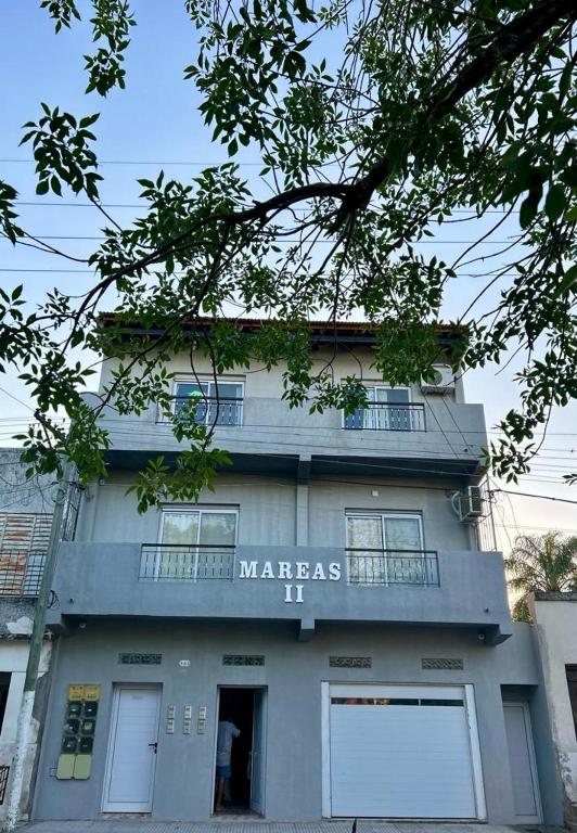 a building with a sign that reads warrashihi at Mareas II in Esquina