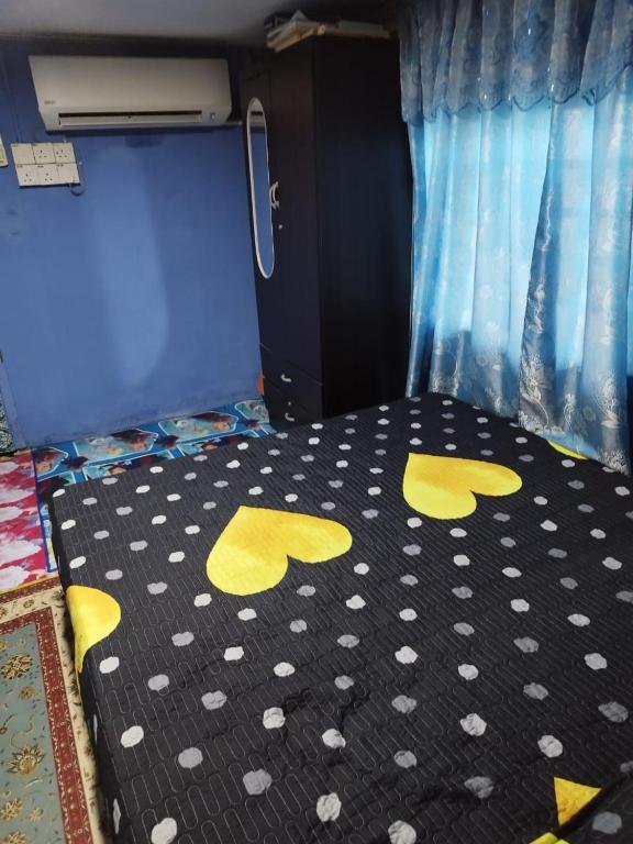 Postel nebo postele na pokoji v ubytování Kubang Sepat HomeStay