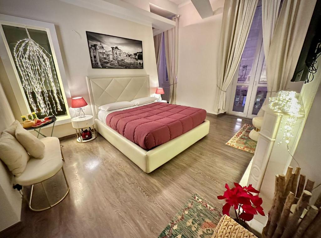 een slaapkamer met een bed en een woonkamer bij RomAntic Dreams Sistina Guest House in Rome