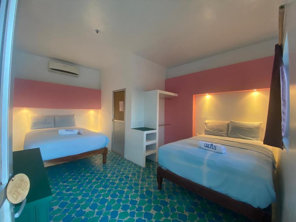 Postel nebo postele na pokoji v ubytování Hotel Casa Cactus HCC