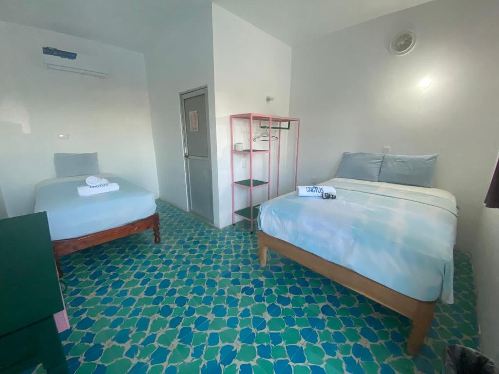 Postel nebo postele na pokoji v ubytování Hotel Casa Cactus HCC
