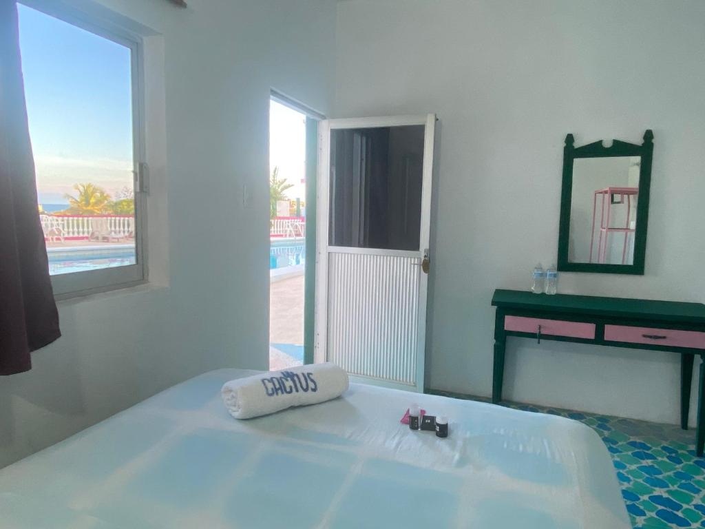 Postel nebo postele na pokoji v ubytování Hotel Casa Cactus HCC