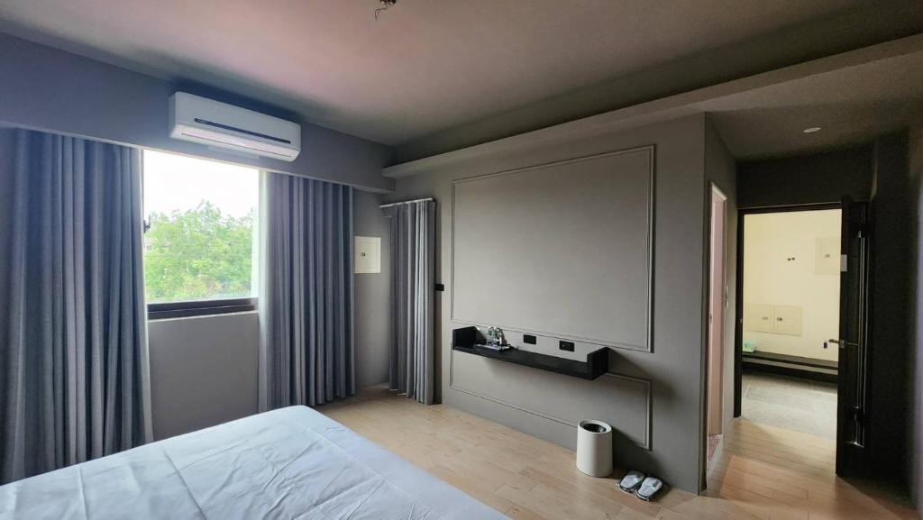 Tempat tidur dalam kamar di Little Shanghai Homestay