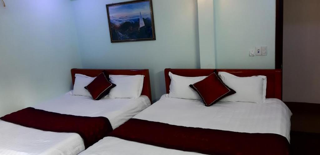 Postel nebo postele na pokoji v ubytování Đại Loan Sapa Hotel