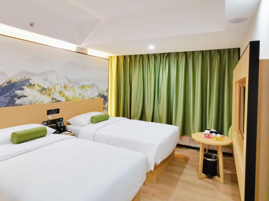 Postel nebo postele na pokoji v ubytování Connar Hotel - Shenzhen Futian