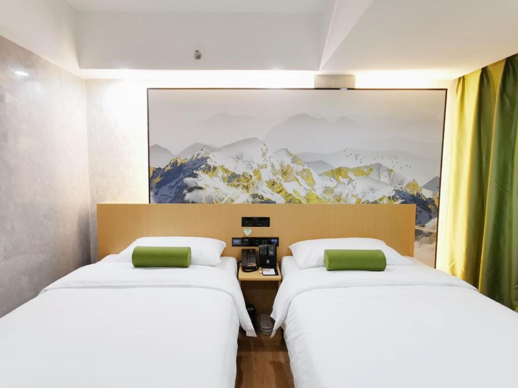 Postel nebo postele na pokoji v ubytování Connar Hotel - Shenzhen Futian