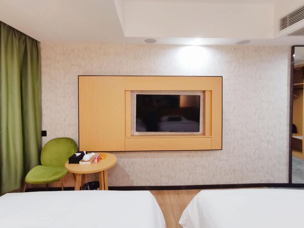 Postel nebo postele na pokoji v ubytování Connar Hotel - Shenzhen Futian