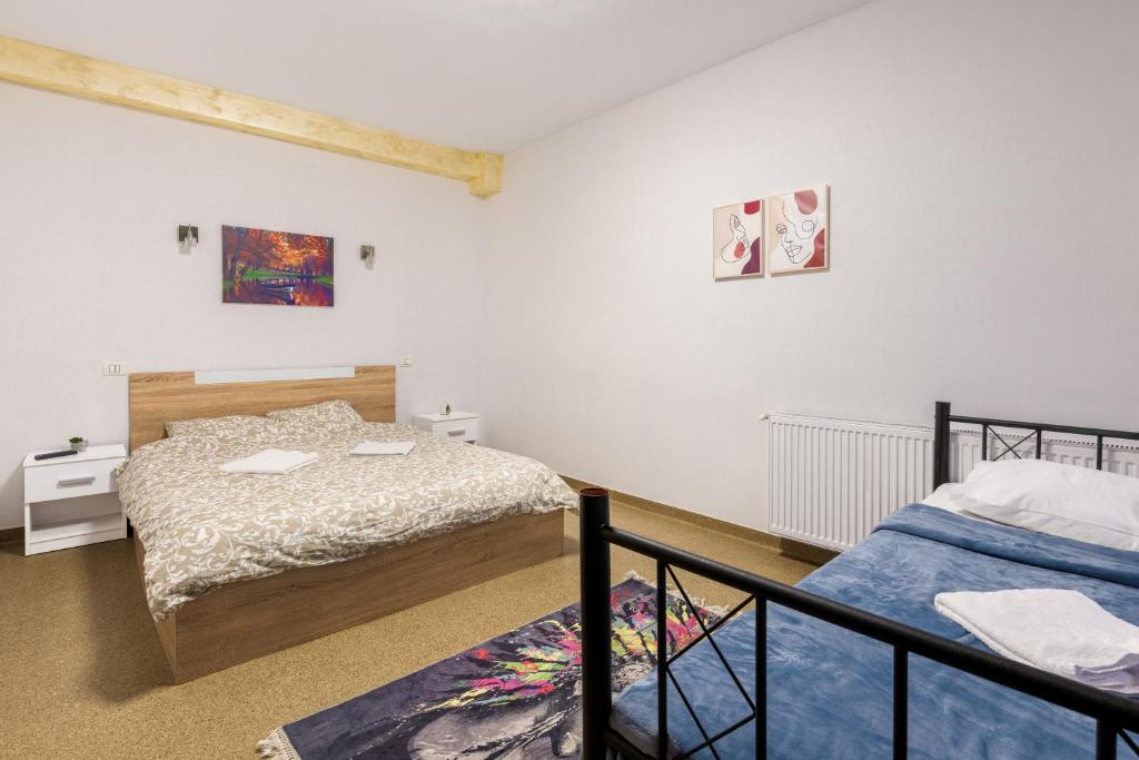Postel nebo postele na pokoji v ubytování Hotel ENZO