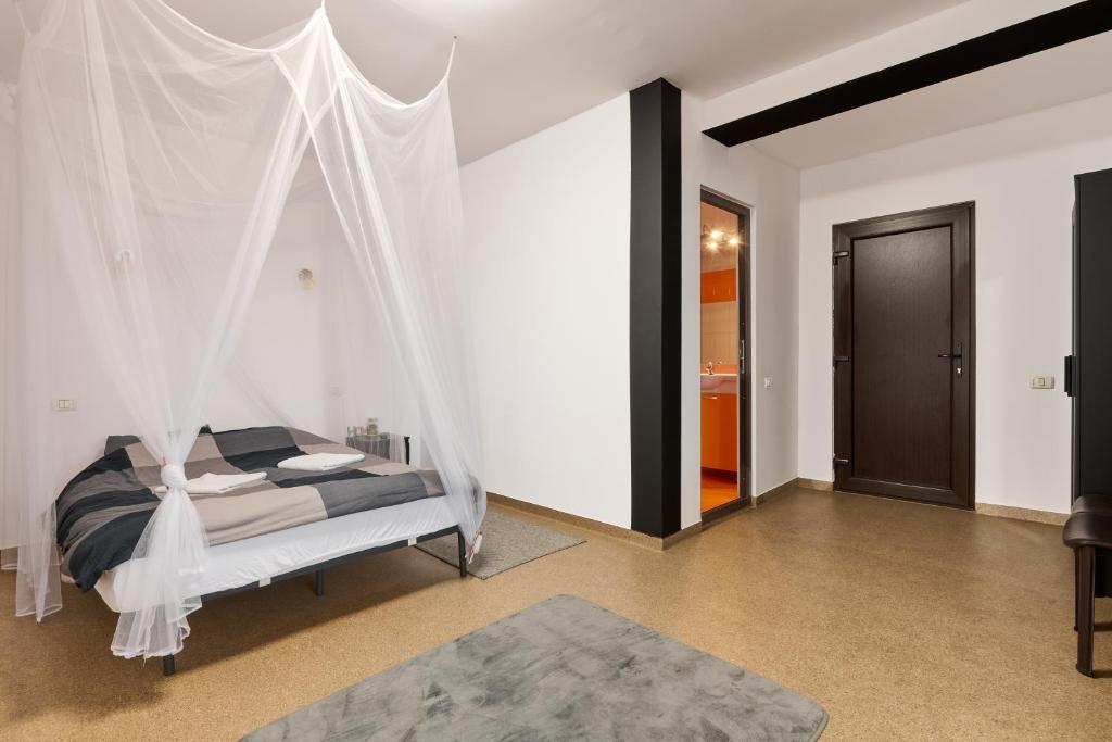 Postel nebo postele na pokoji v ubytování Hotel ENZO