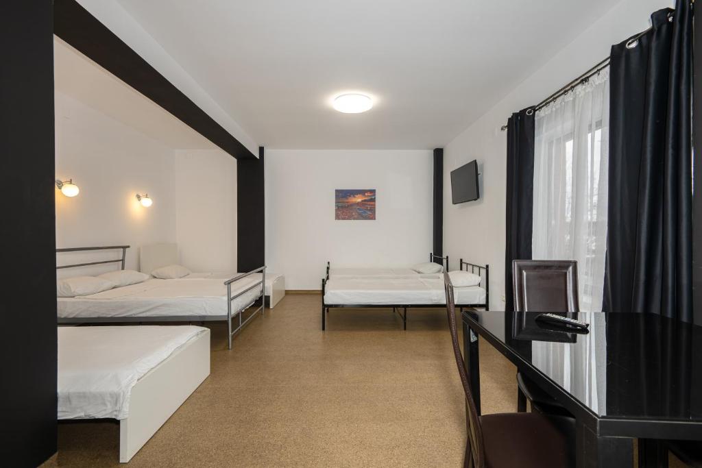 Postel nebo postele na pokoji v ubytování Hotel ENZO