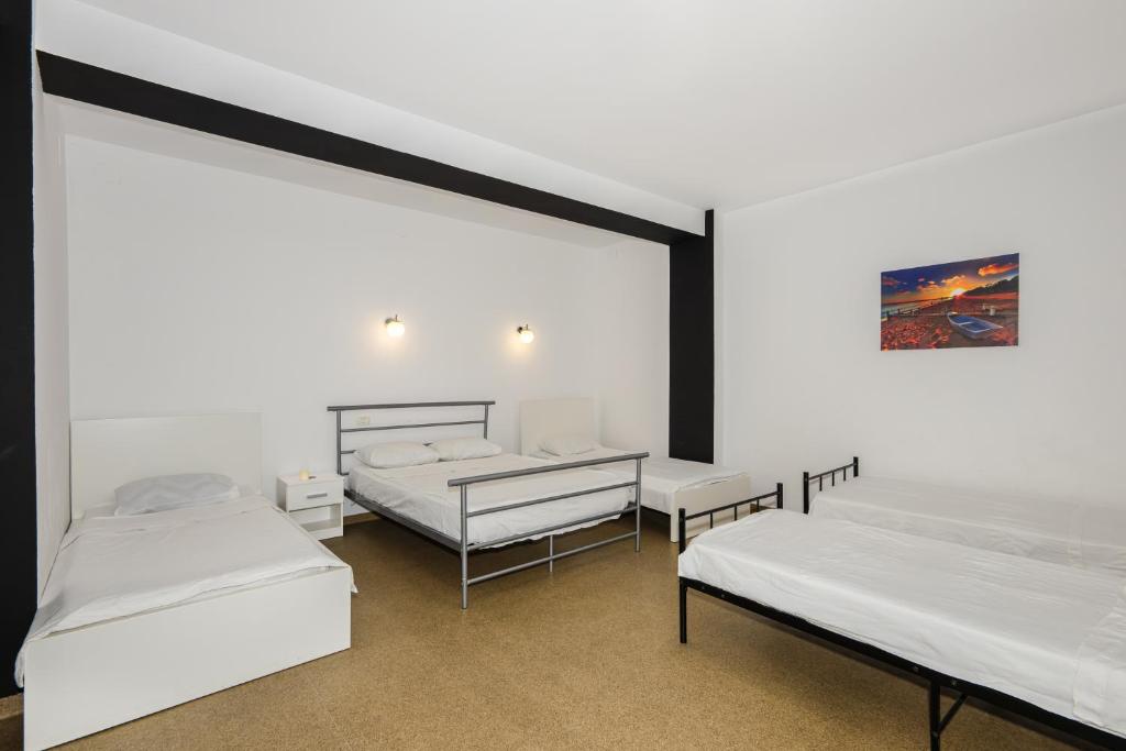 Postel nebo postele na pokoji v ubytování Hotel ENZO