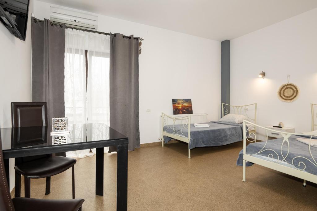 Postel nebo postele na pokoji v ubytování Hotel ENZO
