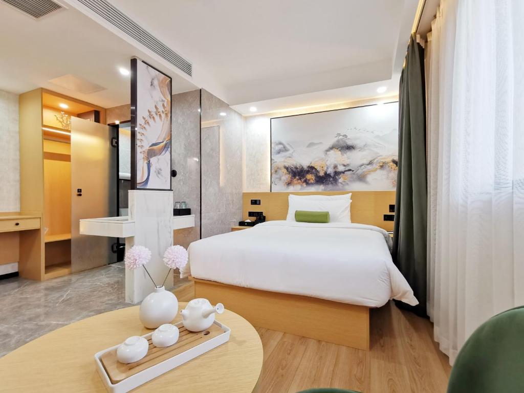 Postel nebo postele na pokoji v ubytování Connar Hotel - Shenzhen Futian