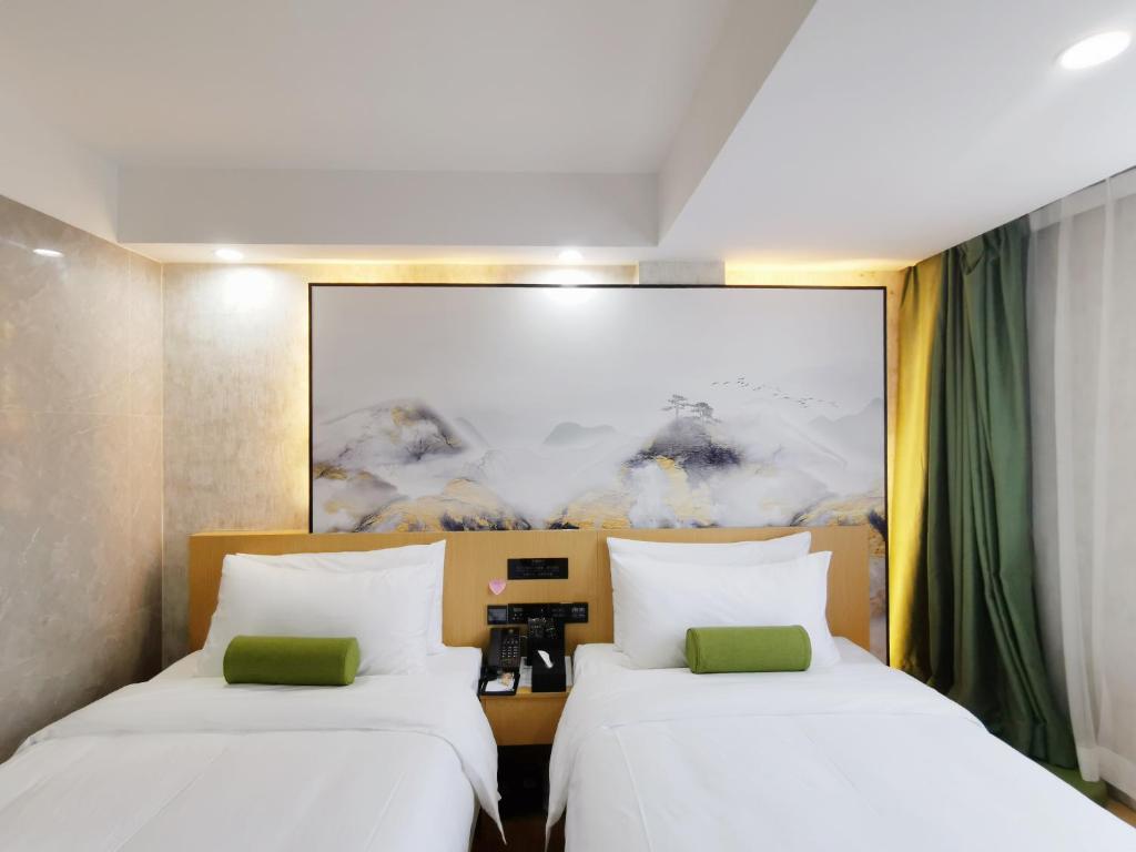 Postel nebo postele na pokoji v ubytování Connar Hotel - Shenzhen Futian