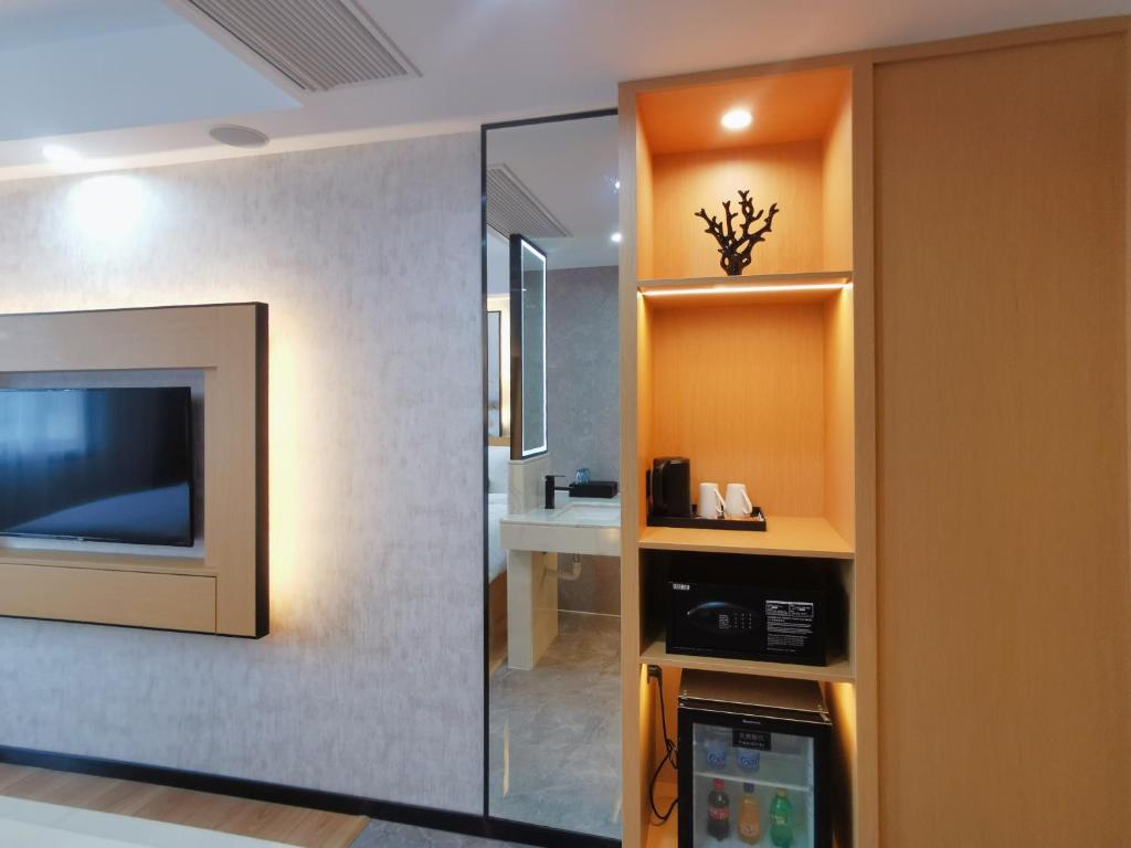 TV a/nebo společenská místnost v ubytování Connar Hotel - Shenzhen Futian