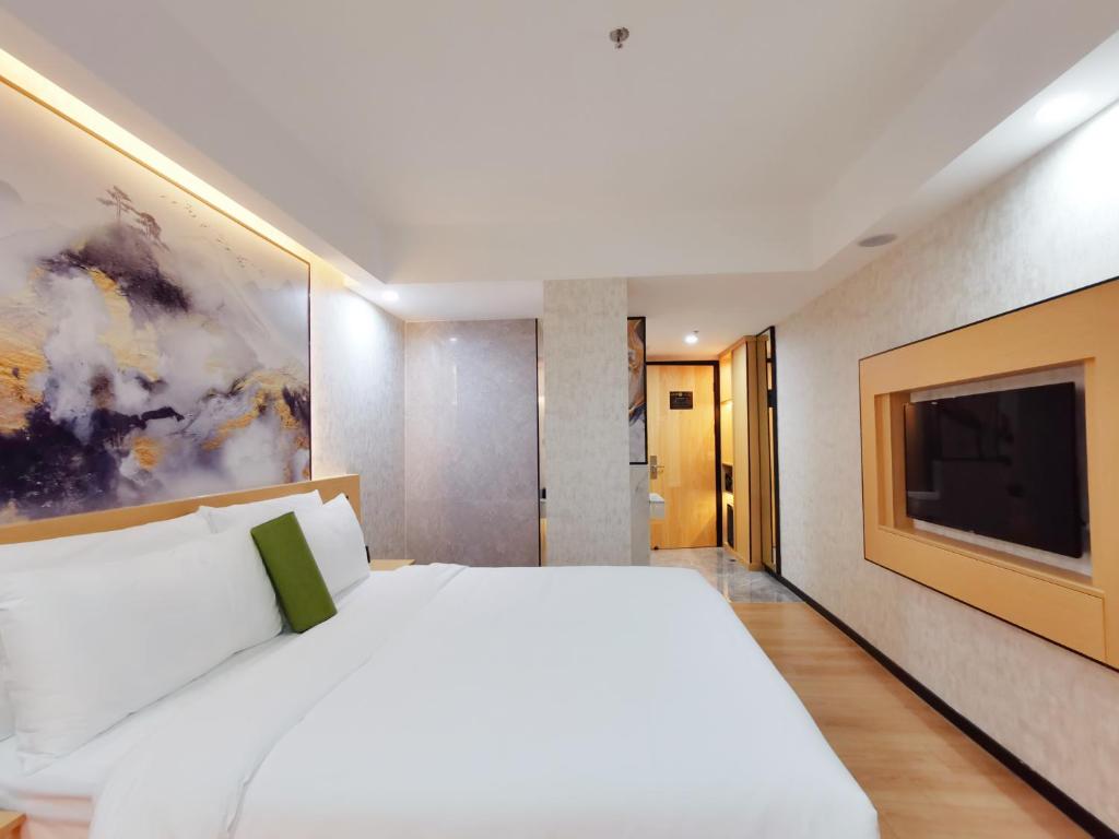 Postel nebo postele na pokoji v ubytování Connar Hotel - Shenzhen Futian