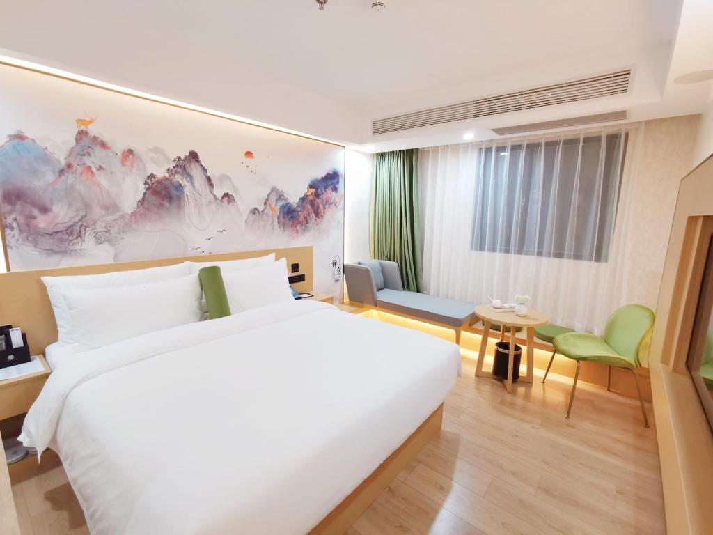 Postel nebo postele na pokoji v ubytování Connar Hotel - Shenzhen Futian