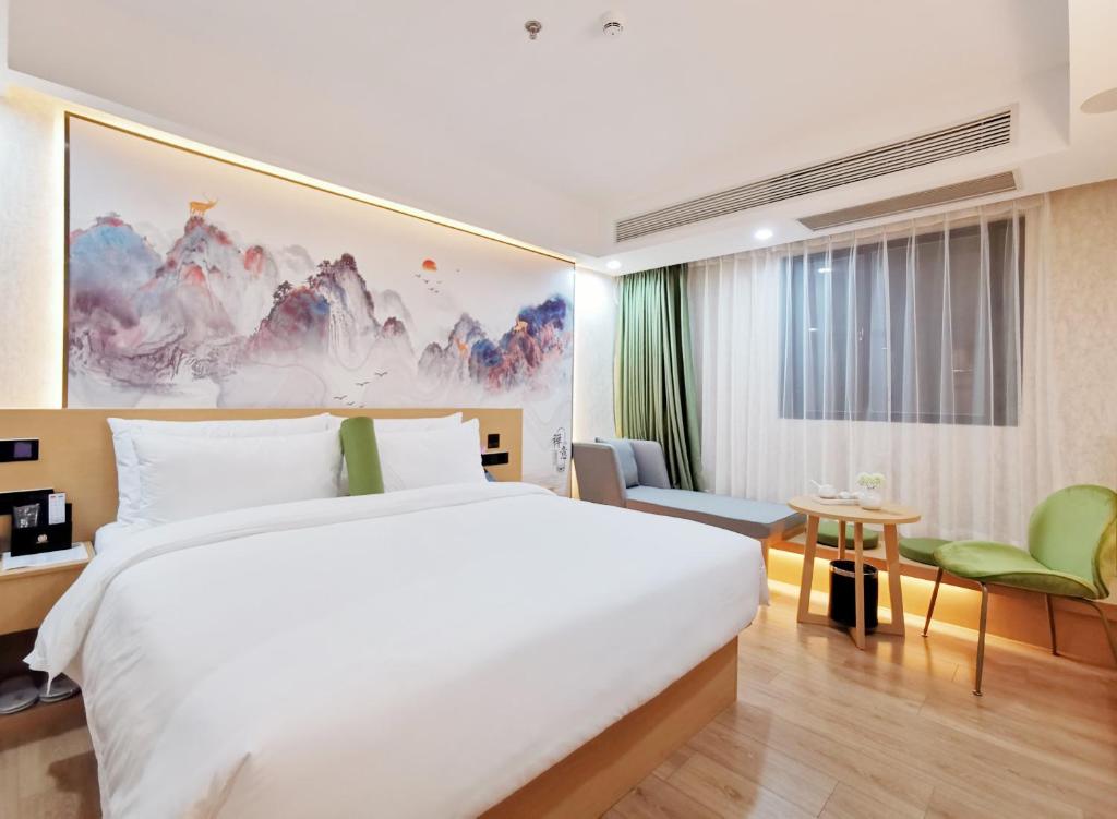 Postel nebo postele na pokoji v ubytování Connar Hotel - Shenzhen Futian