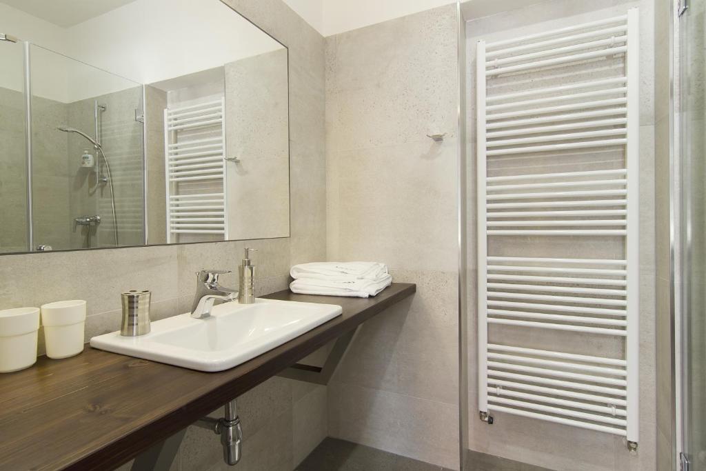 a bathroom with a sink and a mirror at Largo in Český Krumlov