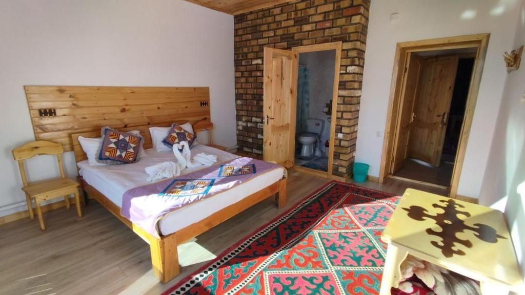 Postel nebo postele na pokoji v ubytování Guest House Jekshen