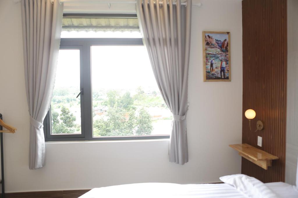 Postel nebo postele na pokoji v ubytování AN PHÚ Home