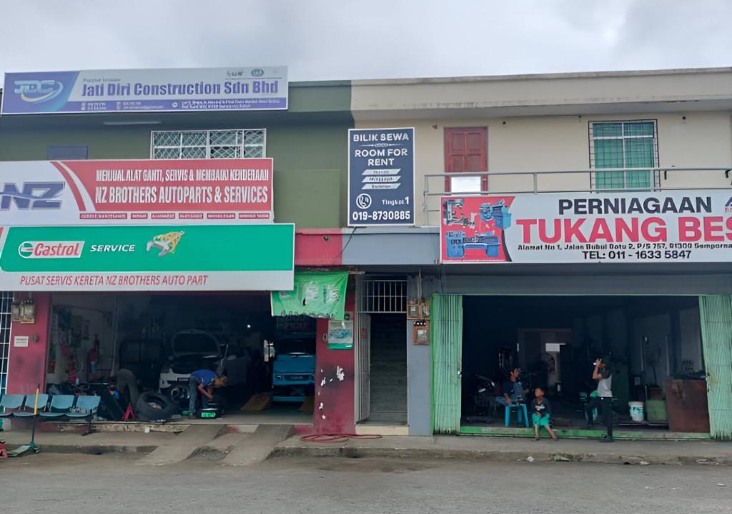 a group of shops with signs in front of them at May Room Semporna in Semporna