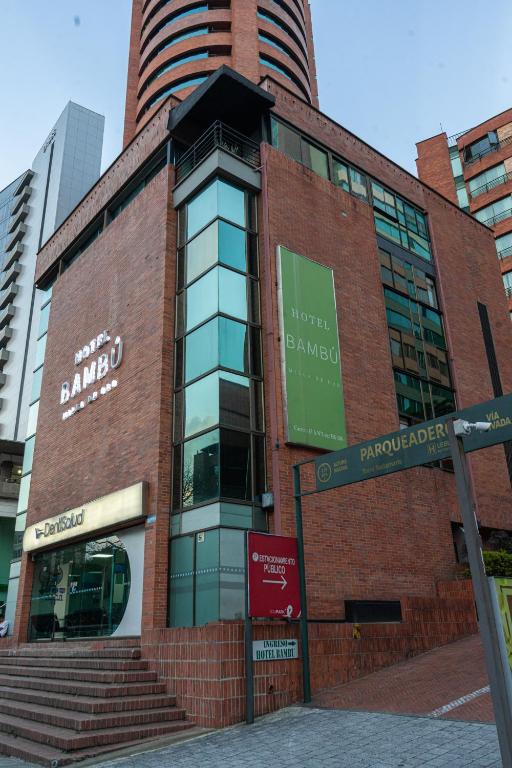 a brick building with a sign on the side of it at Hotel Bambu Milla De Oro in Medellín
