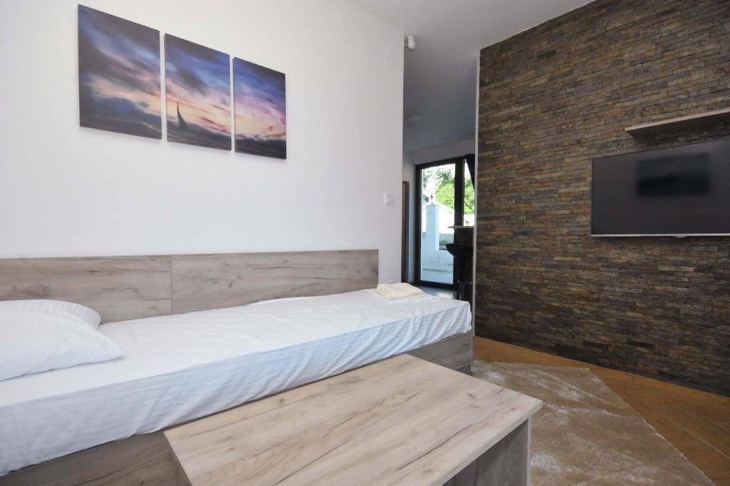 Postel nebo postele na pokoji v ubytování Apartments A Čanj