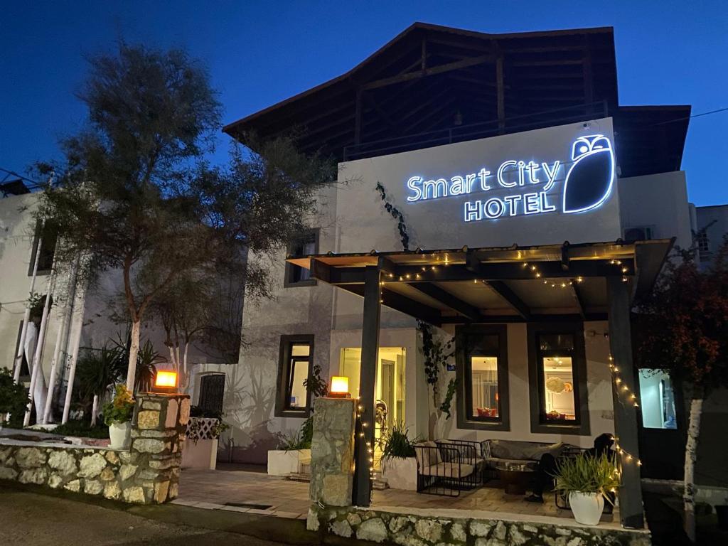 a smart city hotel sign on the front of a building at Bodrum Smart City Hotel in Bodrum City