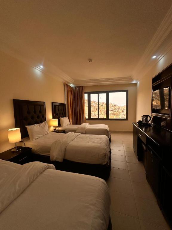 Postel nebo postele na pokoji v ubytování Sharah Mountains Hotel