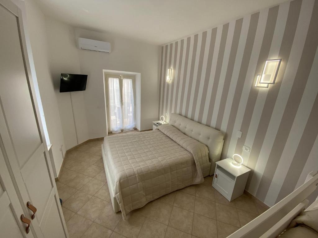 Postel nebo postele na pokoji v ubytování Terrazza su Tocco