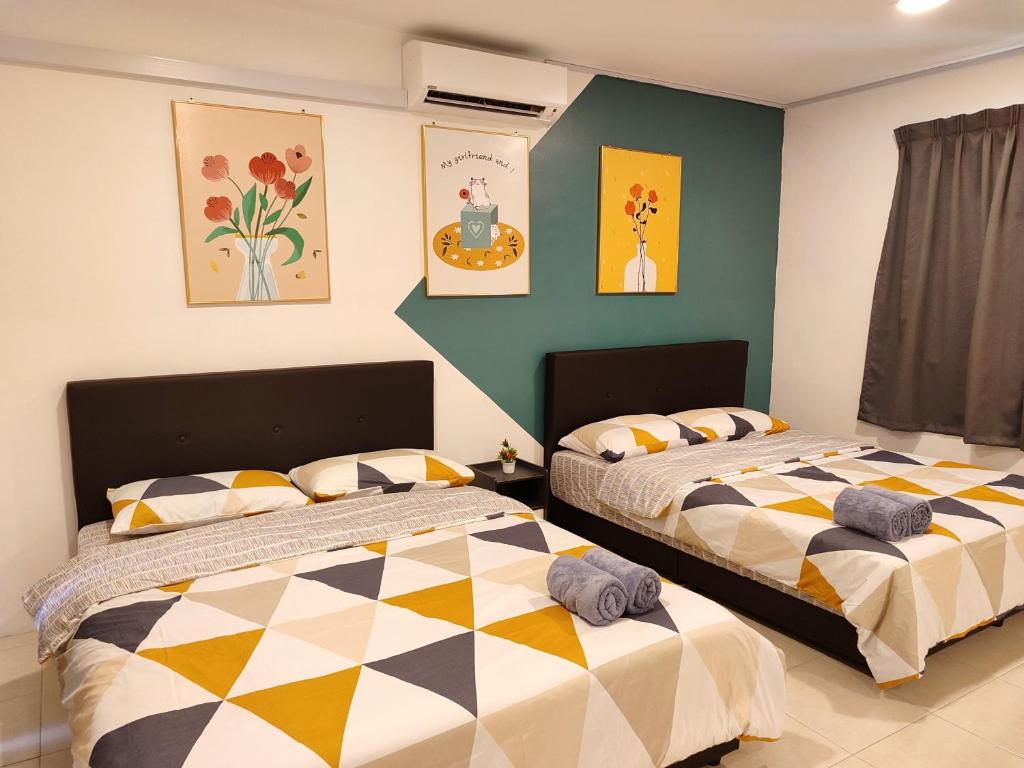 Postel nebo postele na pokoji v ubytování Golden 78 Ipoh Homestay