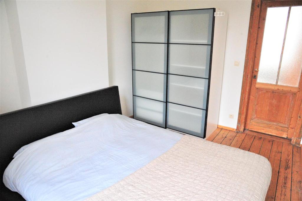 Postel nebo postele na pokoji v ubytování Boho Apartments - 2 Bedrooms
