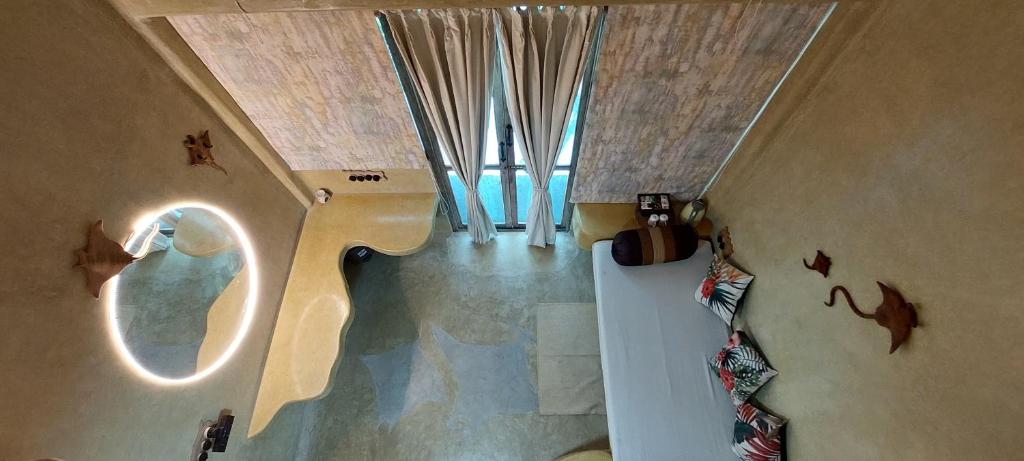 a bathroom with a toilet in a room at Matsya in Havelock Island
