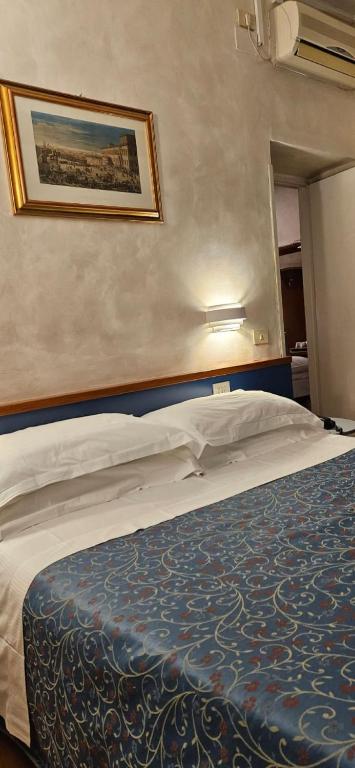 Ліжко або ліжка в номері Hotel Julia