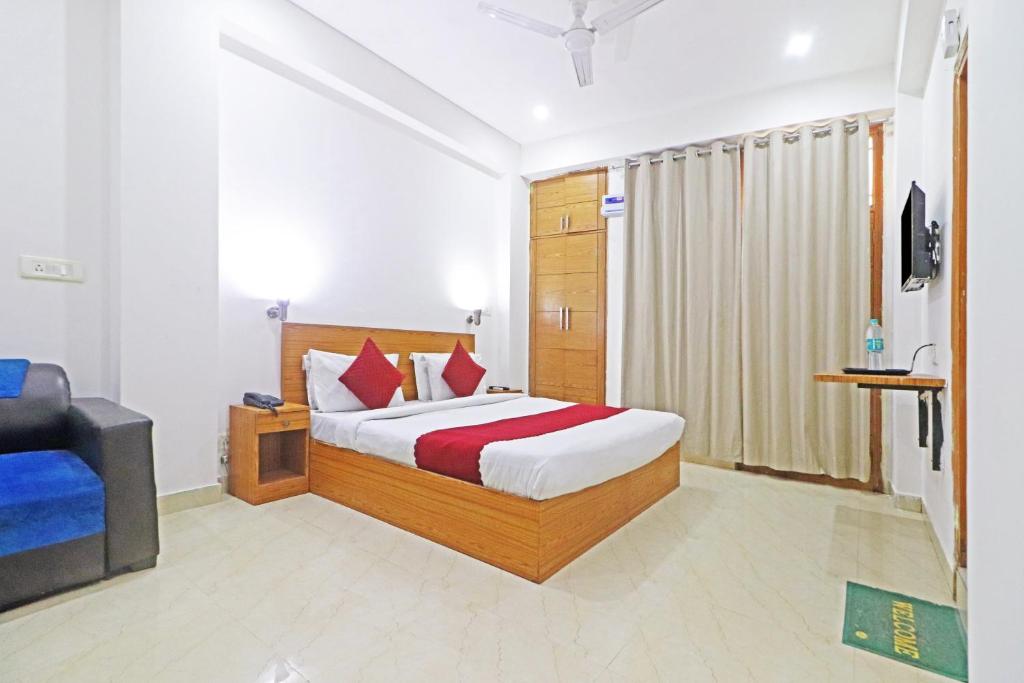 a hotel room with a bed and a television at Hotel Trendy residency in New Delhi