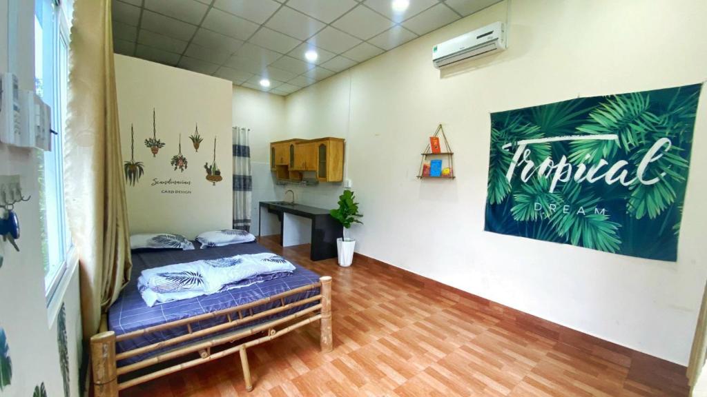 Postel nebo postele na pokoji v ubytování Hide Away Bungalows in Ben Tre City
