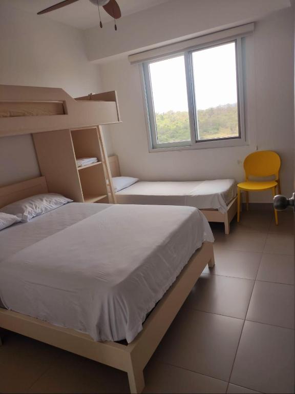 Postel nebo postele na pokoji v ubytování Resort Playa Azul Departamentos