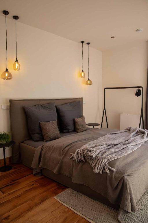 a bedroom with a large bed in a room at N6Quartier in Bad Münstereifel